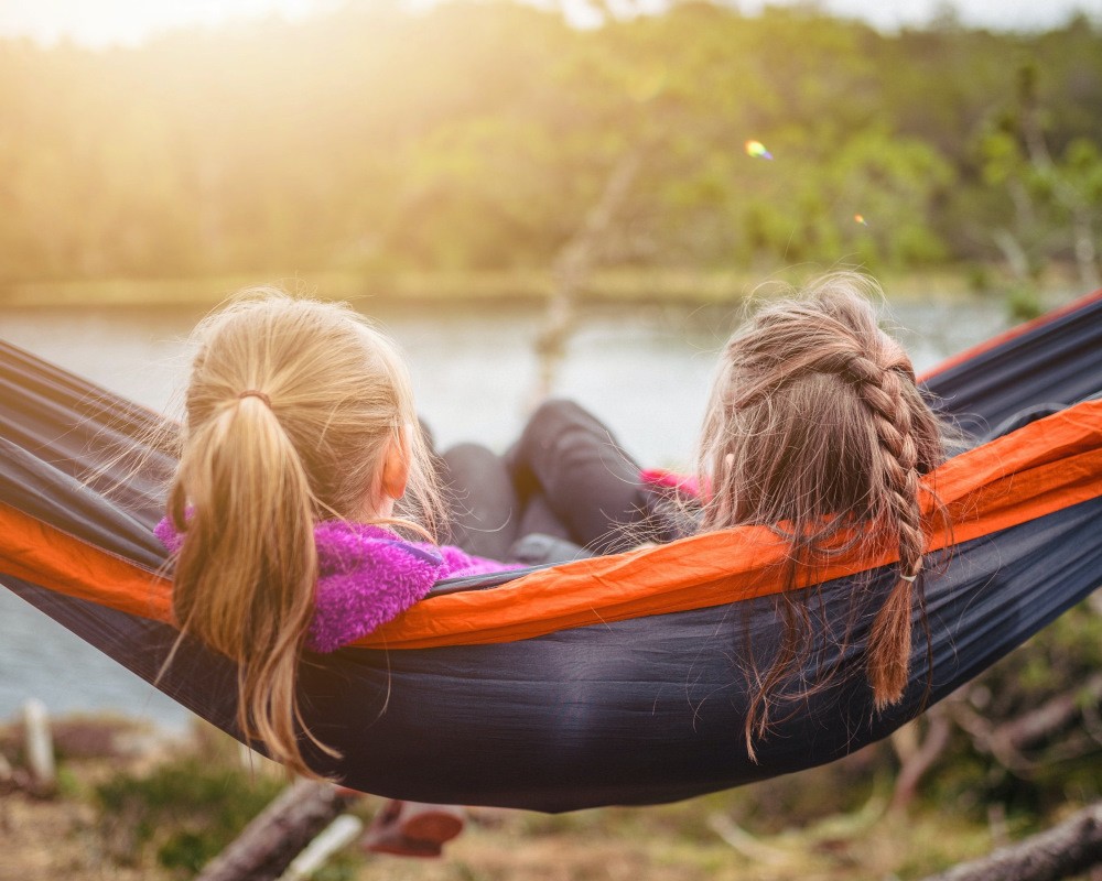 children laying on a sensory hammock